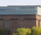 Tate Modern in London -a large sign on their exterior that reads - Release Ai Weiwei